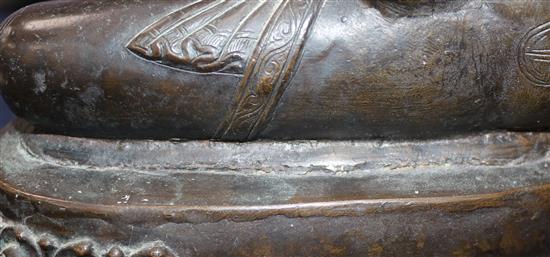 A large Tibetan bronze seated figure of Buddha Shakyamuni, probably 13th century, height 39.5cm, minor old repairs